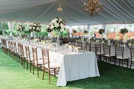 outdoor tented reception made elegant with draping and chandeliers bridal bliss wedding wedding rentals tent rental wedding wedding tent