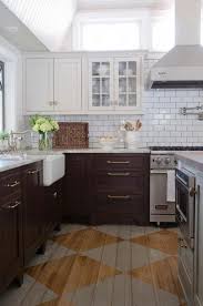 The dark gray countertop in this home provides a softer contrast for the white cabinets, but it's still an ideal choice for this style and a good option for homeowners who don't prefer a glaring contrast. 78 Stylish Dark Brown Cabinets Kitchen Suitable For Cooking Roundecor Brown Kitchen Cabinets Kitchen Flooring New Kitchen Cabinets