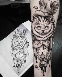 Meaning of cheshire cat tattoo. Grey Cheshire Cat Tattoo Best Tattoo Ideas Gallery Grinsekatze Tattoo Arm Tattoo Tatowierungen