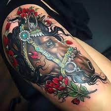 You can improve it as a unicorn tattoo. Cool Brown Horse Head Tattoo Idea Amazing Horse Head With Red Flowers On The Thigh Head Tattoos Horse Tattoo Thigh Tattoos Women