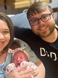 Mom, Dad, and baby share more than just a birthday