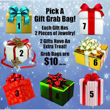 The grab bag is a fun time of drawing small gifts out of a mystery bag. Grab Bags Holiday Jewelry Display Letter Charms Holiday Mystery Bags