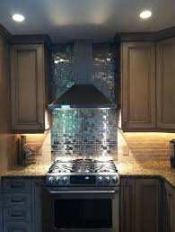 Notice how a stainless steel backsplash adds a crucial note of gleam to these urban kitchens: 28 Stainless Steel Metal Backsplash Ideas Sebring Design Build