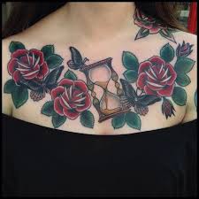Rose tattoos typically symbolize love and beauty. Hourglass And Red Roses Tattoo On Girl Chest