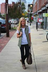How To Wear It Well 15 Ways To Wear A Military Utility Vest Long Vest Outfit Vest Outfits For Women Vest Outfits