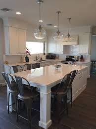 Another minimalist kitchen with white kitchen island with extended table on one side. White Shaker Waypoint Cabinets Designed By Nathan Hoffman Kitchen White Shaker Whites Modern Kitchen Island Design Kitchen Layout Modern Kitchen Island