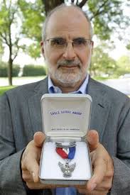 As Eagle Scouts return medals in protest, BSA's ban