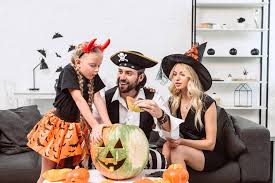 Check spelling or type a new query. Family In Halloween Costumes On Sofa At Coffee Table With Pumpkins At Home Free Stock Photo And Image