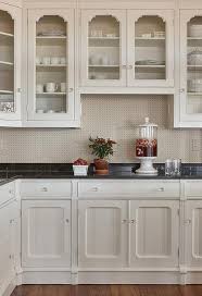 Off white kitchen cabinets with black hardware. Polished Black Marble Countertops With Off White Cabinets Transitional Kitchen
