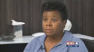 St. Louis mom searches for answers after 'hideous' photo of officer posing  next to dead son with a thumbs up leaks