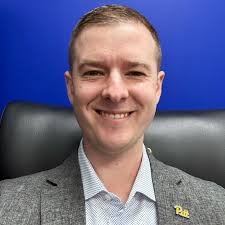 Mark Malcolm, E.M., C.