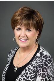 Leslie Coates, Real Estate Agent