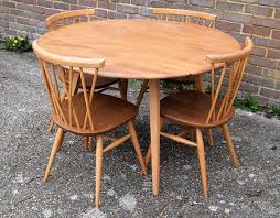 1960s Ercol Drop Leaf Round Dining Table Set Of Four Ercol Round Dining Table Sets Round Dining Table Dining Table Setting