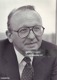 Milton Cooper, founder of Kimco Realty Corp. seated at his desk at... News  Photo