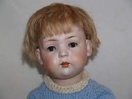 A bruno schmidt toddler bisque head doll with jointed composition body, open mouth with upper teeth, blue sleepy eyes, and a human hair wig. Antique German Bruno Schmidt Bahr Proschild Character Baby Doll Baby Dolls Boy Doll Dolls