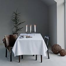 Finished with mitred frames, each crisp white polyester table accent features burnout snowflake designs. Snowflakes Tablecloth By Georg Jensen Damask