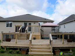 Love The Bbq Place Love The Hot Tub And The Empty Space In The Bottom Level Could Use Some Chairs A Beer Patio Deck Designs Bungalow Backyard Backyard Patio