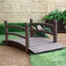 A slight upward arc, eighteen deck boards across two stringers. 18 Small And Beautiful Fairy Tale Garden Bridges Garden In The Woods Small Front Yard Landscaping Garden Bridge