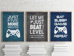 Our game room canvas art is stretched on 1.5 inch thick stretcher bars and may be customized with your choice of black, white, or mirrored sides. Set Of 3 Video Gamer Graphic Prints 8x10 Or 11x14 Matted Etsy Boys Game Room Video Game Print Gamer Wall Art