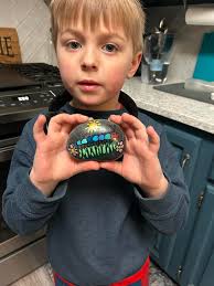 Very proud of his find. A natural rock collector just like his momma 😉