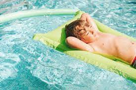 Inflatable giant swim pool floats raft air lounge bed swimming pool beach float. Cute Little Boy Relaxing On Inflatable Raft At Swimming Pool Stock Photo Picture And Royalty Free Image Image 100704073