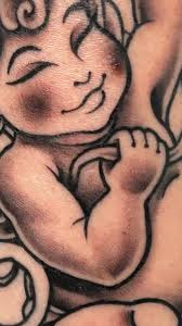 Little cherub bell tattoo for @erika_sigel for our daughter. My favorite  part was the toes!