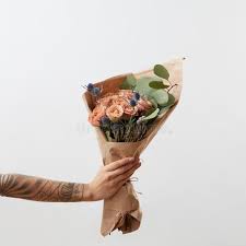 Maybe you would like to learn more about one of these? Delicate Flowers Living Coral Roses And Eryngium As A Beautiful Bouquet In Girl S Hand With Tattoo Copy Space Stock Image Image Of Card Decoration 144420337