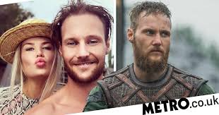 Vikings co-stars Jordan Patrick Smith and Sophie Vavasseur reunite for  'kissing day'