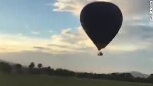 The balloon's basket caught fire after crashing into the median of a busy street. Hot Air Balloon Crash Caught On Camera Cnn Video