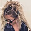 Separate the top half of your hair for the first plait. 1