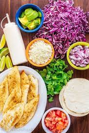 The cilantro and lime give a burst of fresh summer flavor, while the onions, carrots, and cabbage give this side a nice crunch. Fish Tacos Recipe With Best Fish Taco Sauce Natashaskitchen Com