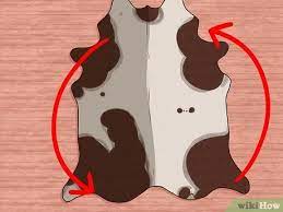 Let the solution absorb slightly and then use a scrubbing brush on the rug to really work the solution into the stain. 3 Ways To Clean A Cowhide Rug Wikihow