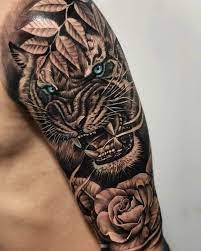 15 Best Tiger And Rose Tattoo Designs Petpress Tiger Tattoo Sleeve Wolf Tattoo Sleeve Rose Tattoos For Men