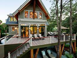 Oversized windows on both the front and back of this modern home provide beautiful views of the surrounding landscape, while offering a light and airy. Beautiful Backyard Decks Patios And Fire Pits Hgtv