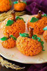 60 Fun Halloween Snacks For Kids To Devour This October Halloween Snacks For Kids Pumpkin Rice Krispie Treats Halloween Food For Party
