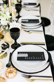 Black And White Table Setting Modern Black White And Gold Table Setting For A Chic All Hallows Eve Soiree Minimalistic Dinner Party Table Settings Dinner Party Table Halloween Party Dinner