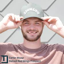 Our newest Maverick, Carter Mazur, debuting our forest green hat. Michigan  born @carter_mazur grew up chasing his dream of playing professional  hockey. He helped University of Denver win the National Championship and