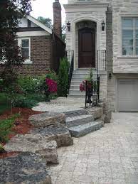 These are the steps on the front porch :$ what's the best way to fill the hole and put a stone in front so it doesn't show such a big gap? Interlocking Tumbled Stone Driveway And Flagstone Steps Drive Lined With Armour Stone Exterior Stairs Decorative Concrete Driveways Flagstone Steps