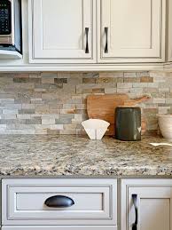 The beautiful wood floors complement the granite countertops and bring depth to this airy room. How To Work With Dated Granite In Your Kitchen