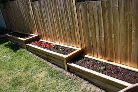 Definitely Going To Build These Along The Fence Line Will Make Yard Work So Much Easier Building A Raised Garden Sloped Garden Small Gardens