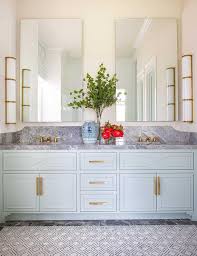 A stylish kitchen in white with a victorian feel and a navy ktichen island, skylights and pendant lamps highlight. Blue Marble Wave Pattern Backsplash Tiles Design Ideas
