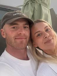 Collingwood's Tom Mitchell goes public with new partner in loved up pics