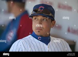Chicago Cubs second baseman Darwin Barney cannot get to a bad throw by  third baseman Mike Olt