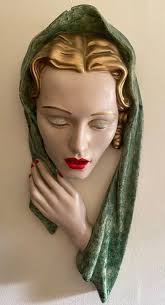 Original 1920/30's Art Deco wall masks.