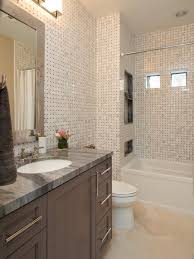 Sleek Tiled Bathroom With Gray Granite Countertops Property Brothers At Home Property Brothers Bathrooms Remodel