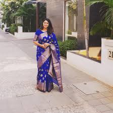 Beautiful top view from passenger supersonic airplane window flying high above white clouds in the blue sky. Actress Kaniha Beautiful In Blue Designer Saree Stills Latest Indian Hollywood Movies Updates Branding Online And Actress Gallery