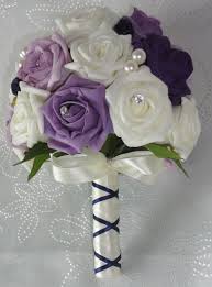 The wedding bouquets you see in these photos represent different styles to inspire all brides, from the more classical ones to those ladies with a bolder there are many types of flowers that are available in lilac or purple colour: Plum And Ivory Wedding Bouquet Bb353 Purple Wedding Bouquets Flower Bouquet Wedding Purple Bridal Bouquet