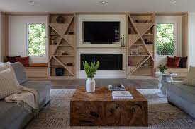 See more ideas about fireplace design, modern fireplace, living room designs. Creative Shelving Shapes Were Designed For This Living Room Wall That Also Includes A Tv Fireplace And A Pair Of Window Seats