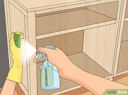 Working from top to bottom, apply the paint to the cabinet exterior across the grain, then tip it off with the grain. How To Paint Kitchen Cabinets Without Sanding With Pictures