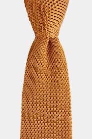 The production of linen fabric involves fibers being spun, combed, and woven into sheets. Mustard Knitted Silk Tie